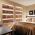 Shelving in bedroom illuminated by white coloured LED linear strip lighting