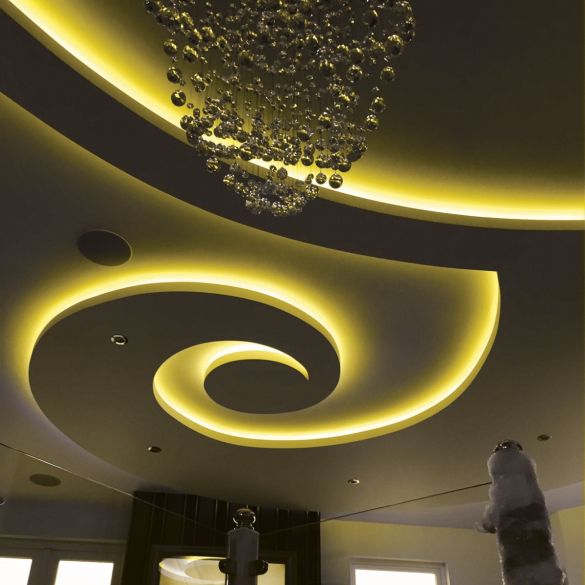 Cove and ceiling illuminated by yellow coloured LED linear strip lighting